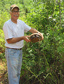 Salem and a turtle on his Tree Farm